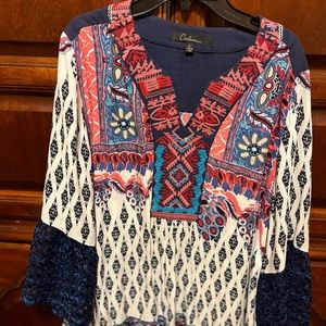 Women’s tunic in blue, pink & white print.